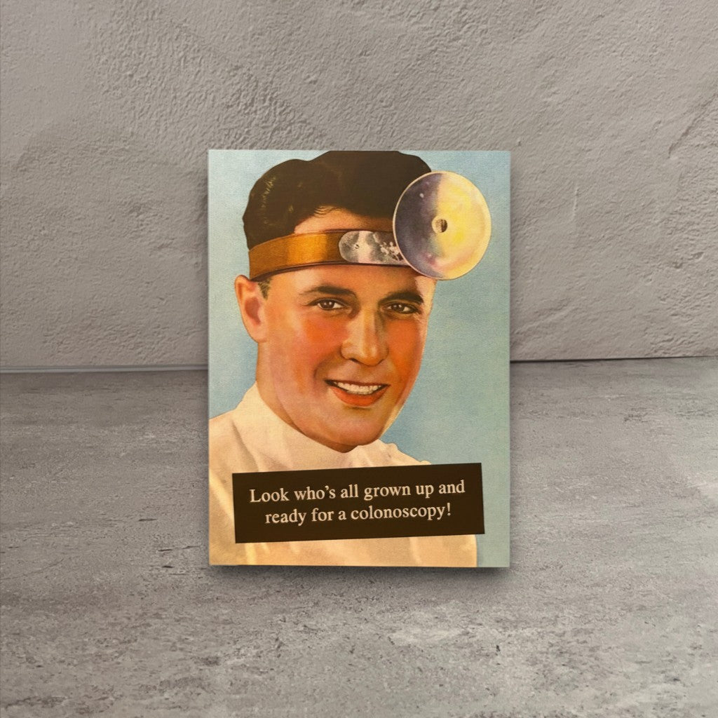 Vintage-style birthday card featuring a doctor with a head mirror and humorous colonoscopy text.