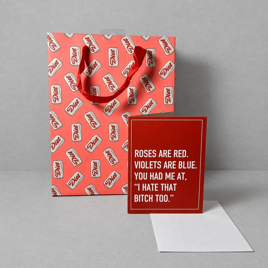 Impish Greetings A2 greeting card with funny text and white envelope next to a red Diet soda patterned gift bag