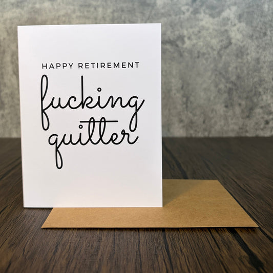 Funny retirement card with black text reading Happy Retirement fucking quitter on white cardstock