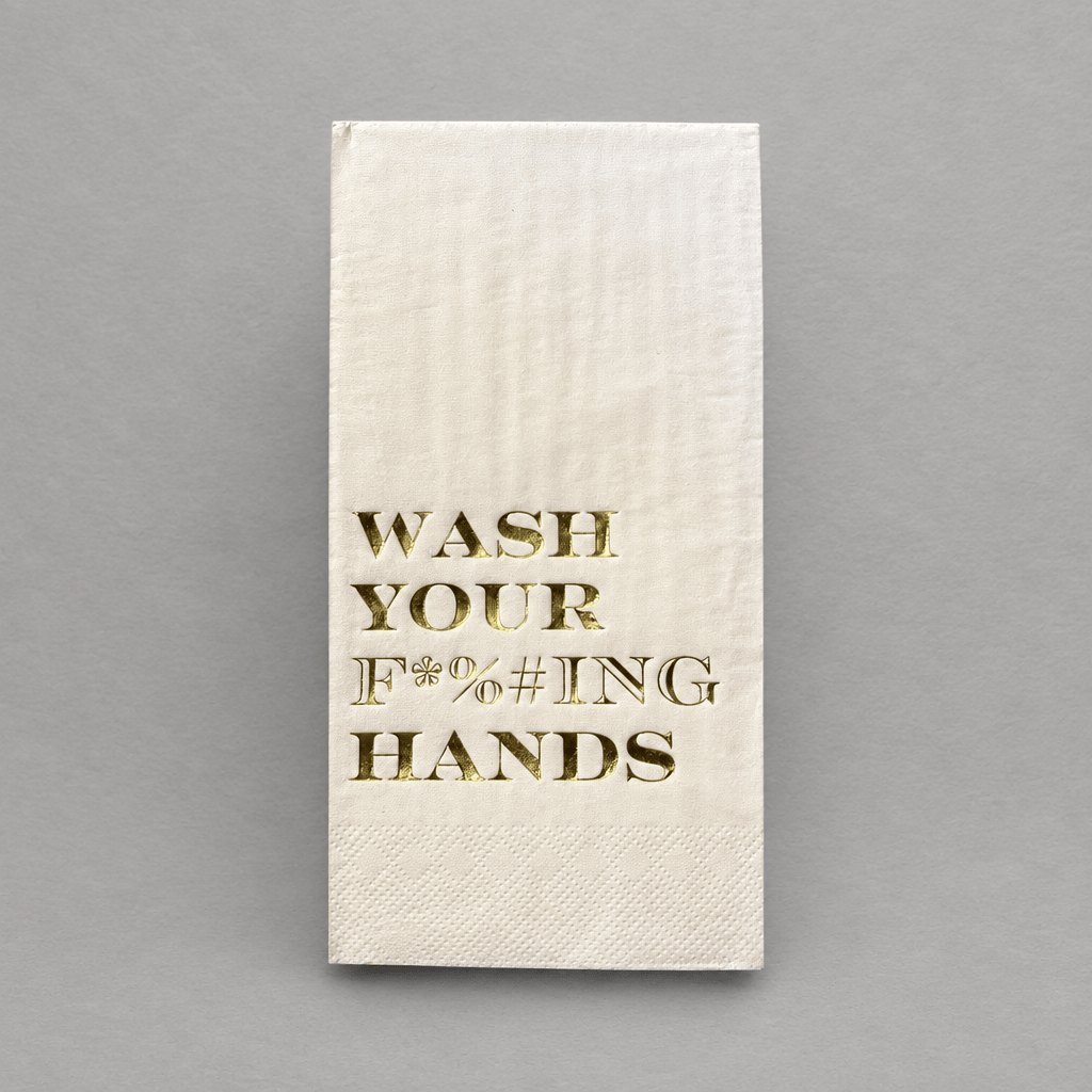 Impish Greetings paper guest towels with gold foil text reading Wash Your F*%#ING Hands on a white 3-ply background.