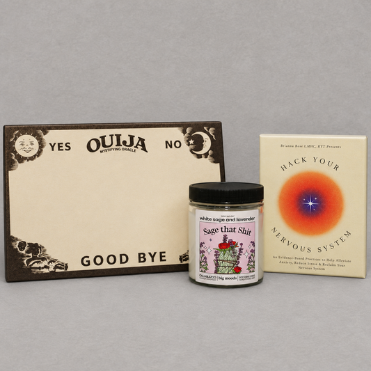 Impish Greetings Good Juju Bundle featuring a Ouija board notepad, Sage That Shit candle, and nervous system card deck.