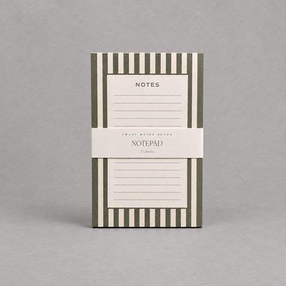 Impish Greetings green and white striped notepad with 75 lined tear-away pages for desk organization.