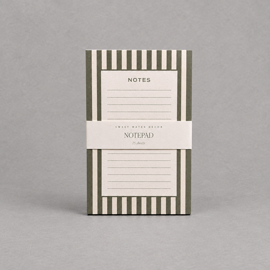Impish Greetings green and white striped notepad with 75 lined tear-away pages for desk organization.