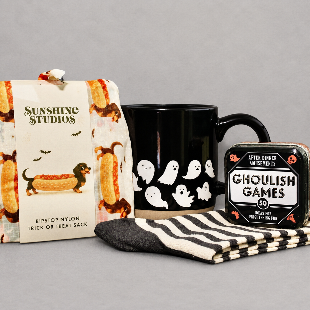Impish Greetings Halloweenie Gift Bundle featuring a ghost mug, ghoulish games, dachshund treat sack, and striped socks