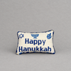 Impish Greetings Happy Hanukkah needlepoint pillow featuring blue menorah and dreidel motifs on a cream wool background