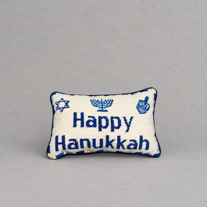 Impish Greetings Happy Hanukkah needlepoint pillow featuring blue menorah and dreidel motifs on a cream wool background
