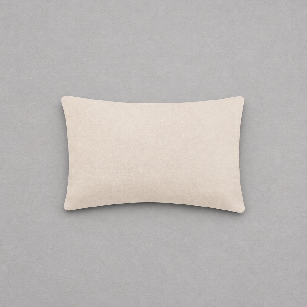 Impish Greetings Happy Hanukkah needlepoint pillow with a soft beige cotton velvet backing on a grey background.
