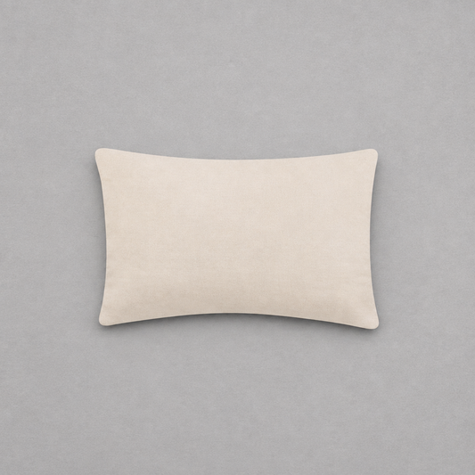 Impish Greetings Happy Hanukkah needlepoint pillow with a soft beige cotton velvet backing on a grey background.