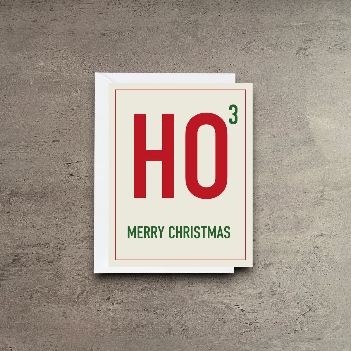 Impish Greetings HO Cubed Christmas card with red and green typography on cream cardstock with white envelope