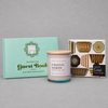 Impish Greetings Hostest with The Mostest gift bundle featuring a bathroom guestbook, lemon candle, and napkins.