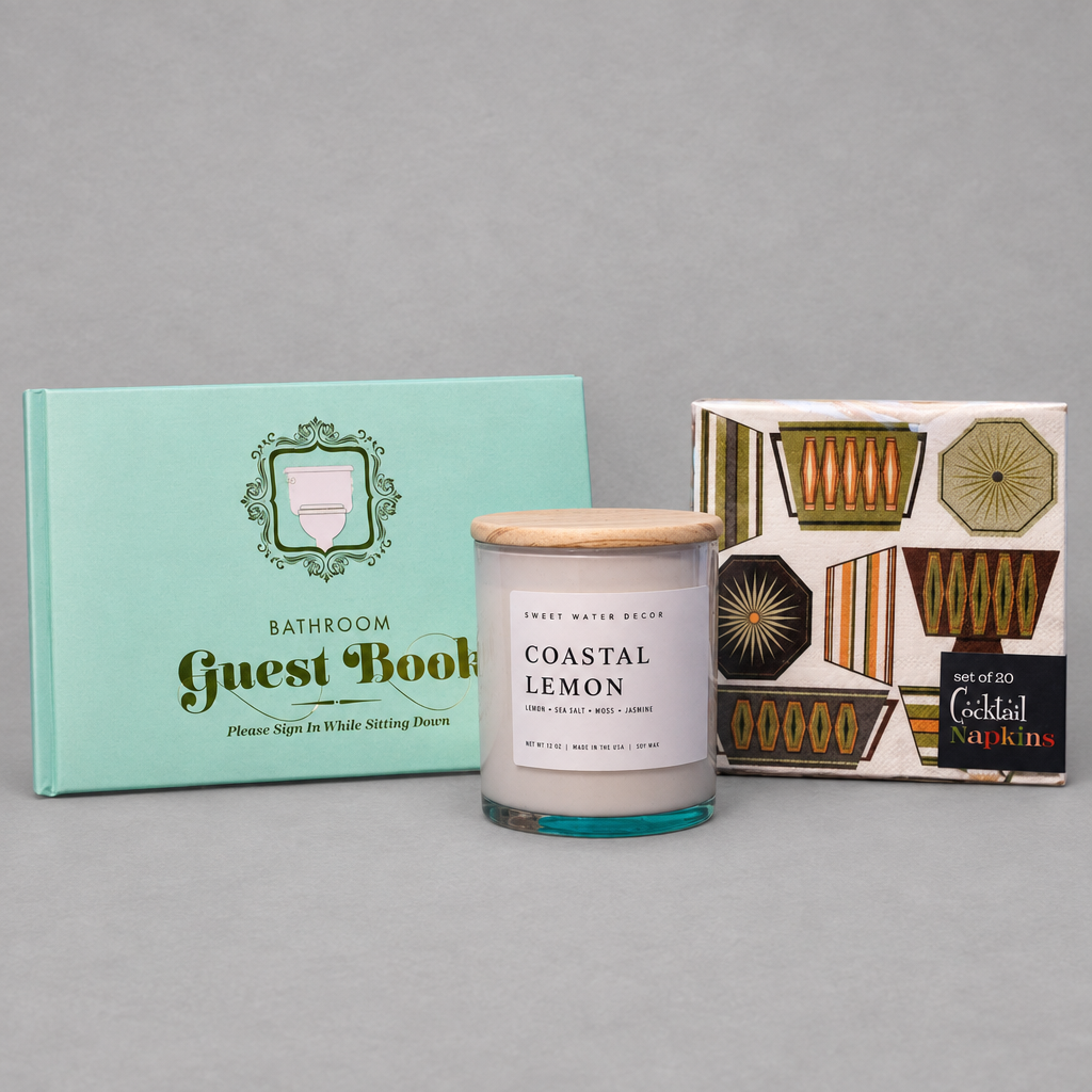 Impish Greetings Hostest with The Mostest gift bundle featuring a bathroom guestbook, lemon candle, and napkins.