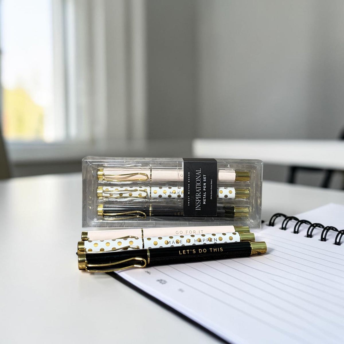 Impish Greetings set of three motivational metal ballpoint pens in pink, black, and white with gold polka dots.
