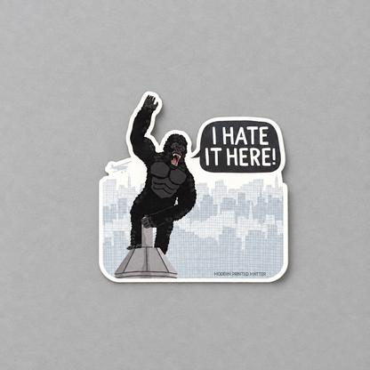 Impish Greetings King Kong sticker featuring a gorilla on a skyscraper with a speech bubble saying I HATE IT HERE