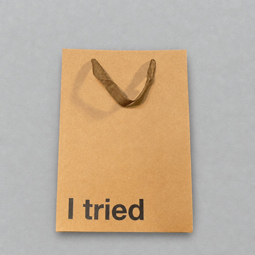 Impish Greetings brown kraft paper gift bag with ribbon handles and the text I tried printed in black