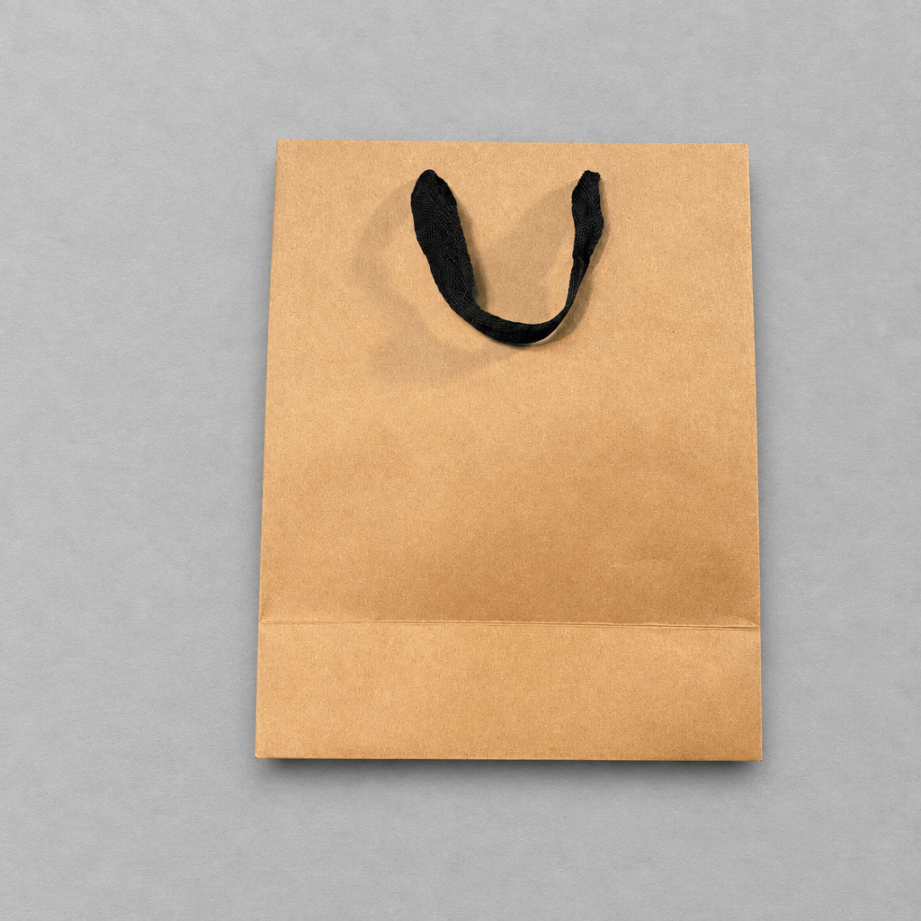 Impish Greetings kraft paper gift bag with black cloth handles for last-minute gifts
