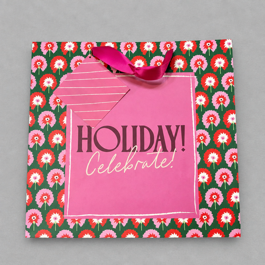 Impish Greetings large gift bag with pink floral pattern, Holiday Celebrate text, and a metallic pink ribbon handle.