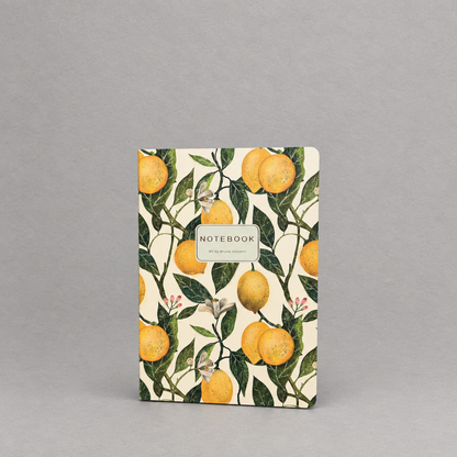 Impish Greetings A5 notebook featuring a cheerful yellow lemon and green leaf print on a softcover.