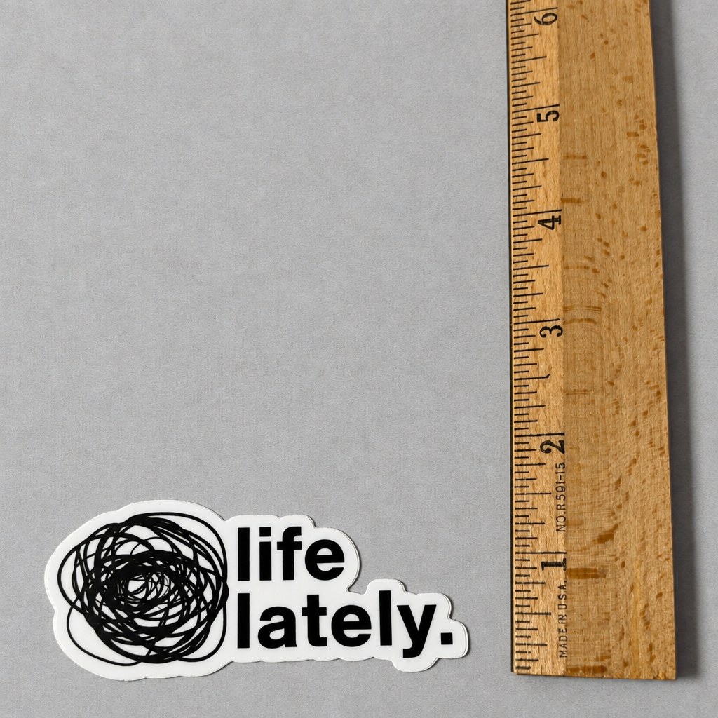 Impish Greetings Life Lately die-cut vinyl sticker with black scribbled circle and text on a grey background.