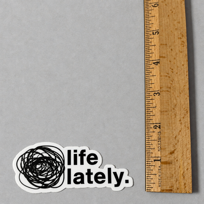 Impish Greetings Life Lately die-cut vinyl sticker with black scribbled circle and text on a grey background.