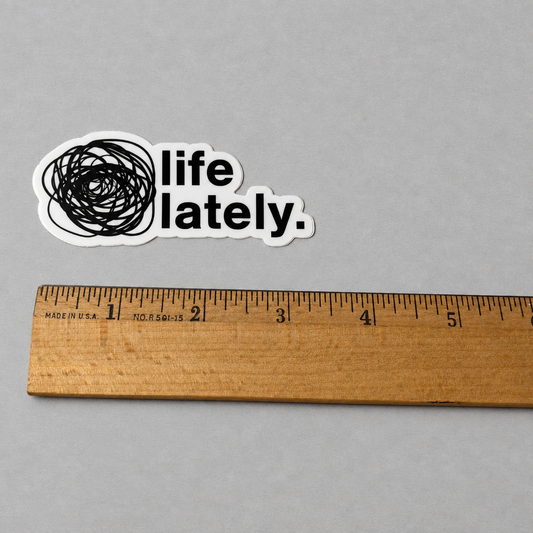 Impish Greetings Life Lately die-cut vinyl sticker with black scribbled circle and text on a grey background