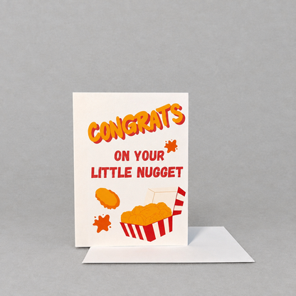 Impish Greetings Congrats On Your Little Nugget baby card with chicken nugget illustration on white cotton paper