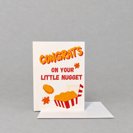 Impish Greetings Congrats On Your Little Nugget baby card with chicken nugget illustration on white cotton paper