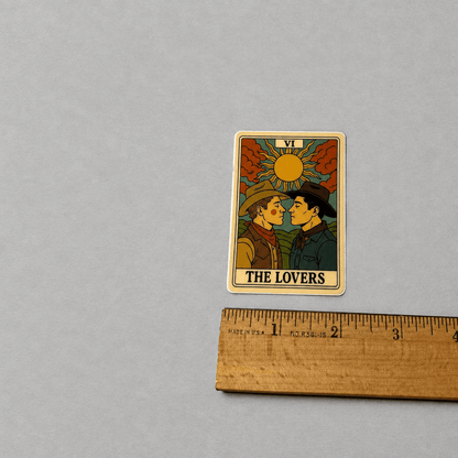 Impish Greetings The Lovers Tarot sticker featuring two cowboys in a romantic illustration with a matte vinyl finish.