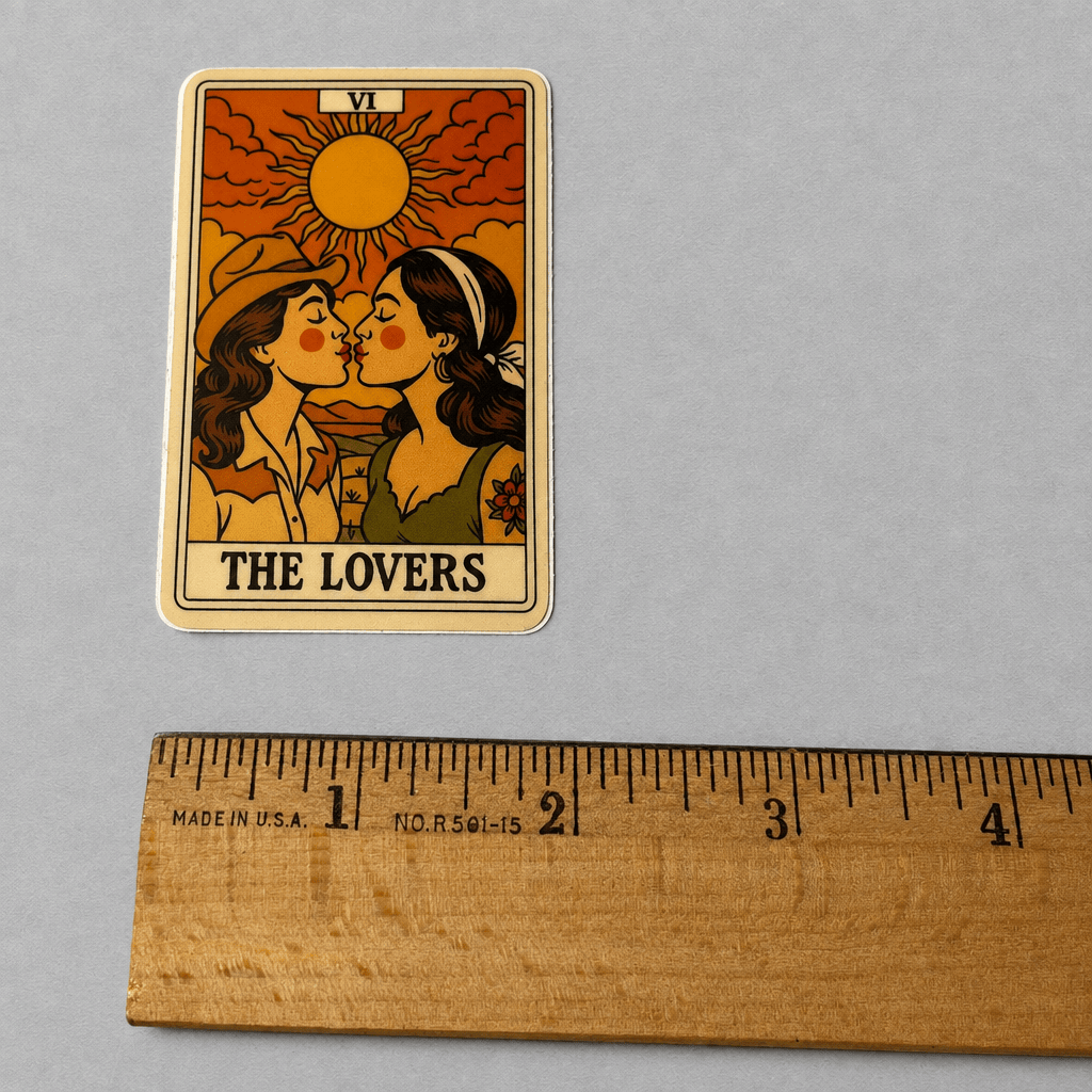 Impish Greetings The Lovers tarot card sticker featuring two cowgirls kissing under a sun, matte vinyl design.