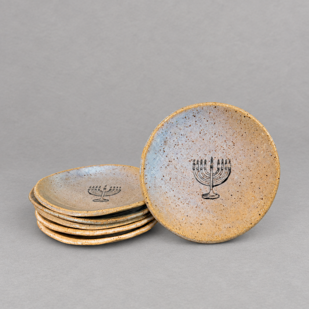 Impish Greetings handmade ceramic stoneware mini plate featuring a black menorah design on a speckled tan glaze.