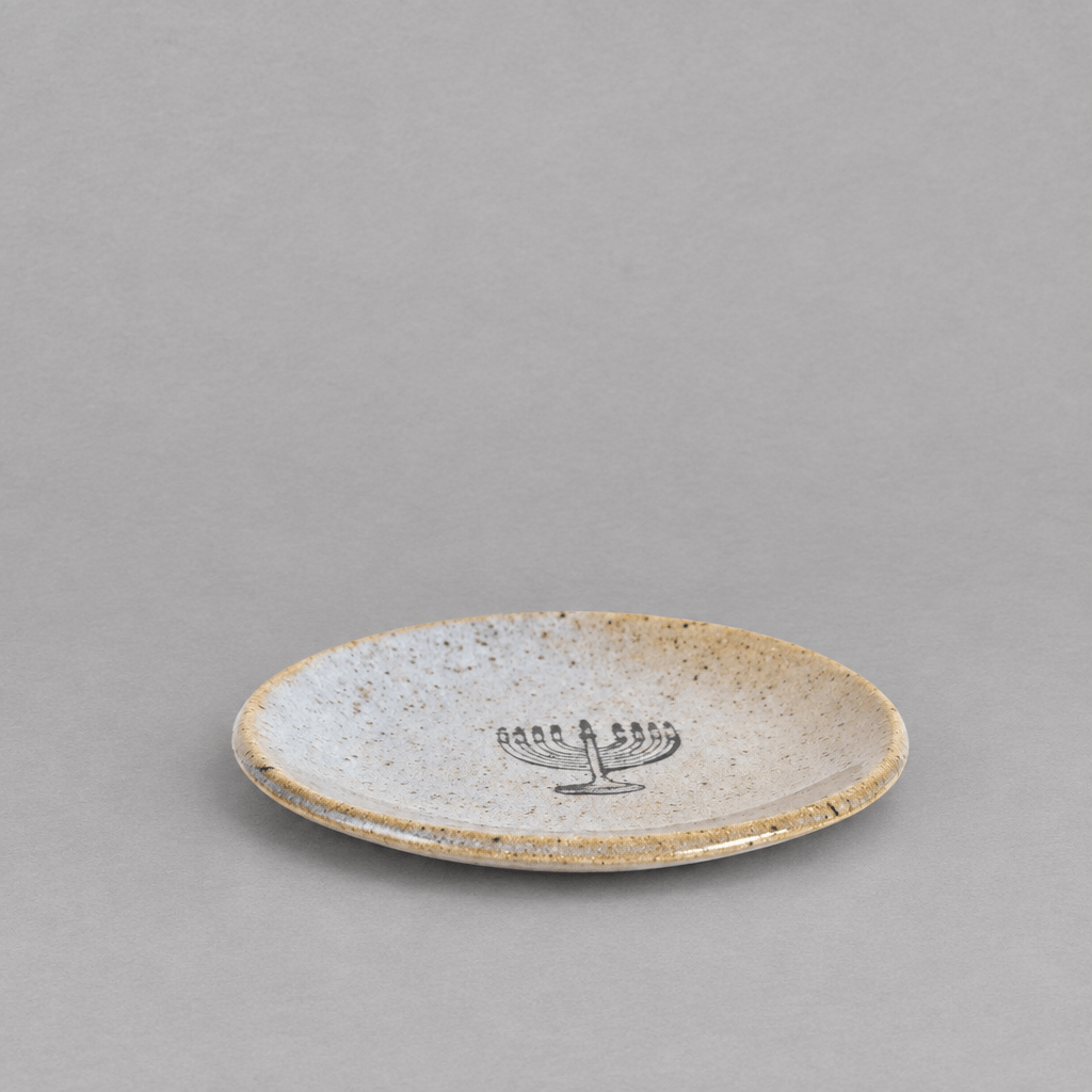 Impish Greetings handmade ceramic stoneware mini plate with a speckled finish and a black menorah design.