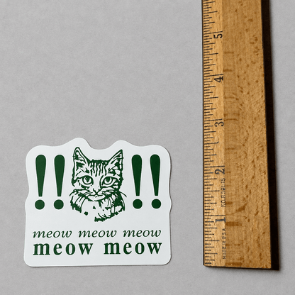 Impish Greetings vinyl sticker featuring a cat illustration with exclamation marks and the text meow meow meow