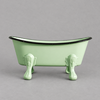 Impish Greetings antique style light green mini clawfoot bathtub soap dish with a black rim on a grey background