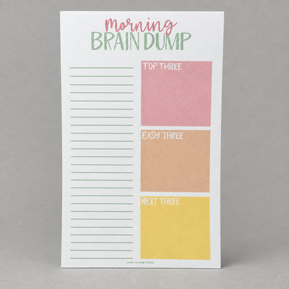 Impish Greetings Morning Brain Dump notepad with lined sections and colorful task boxes on eco-friendly paper.