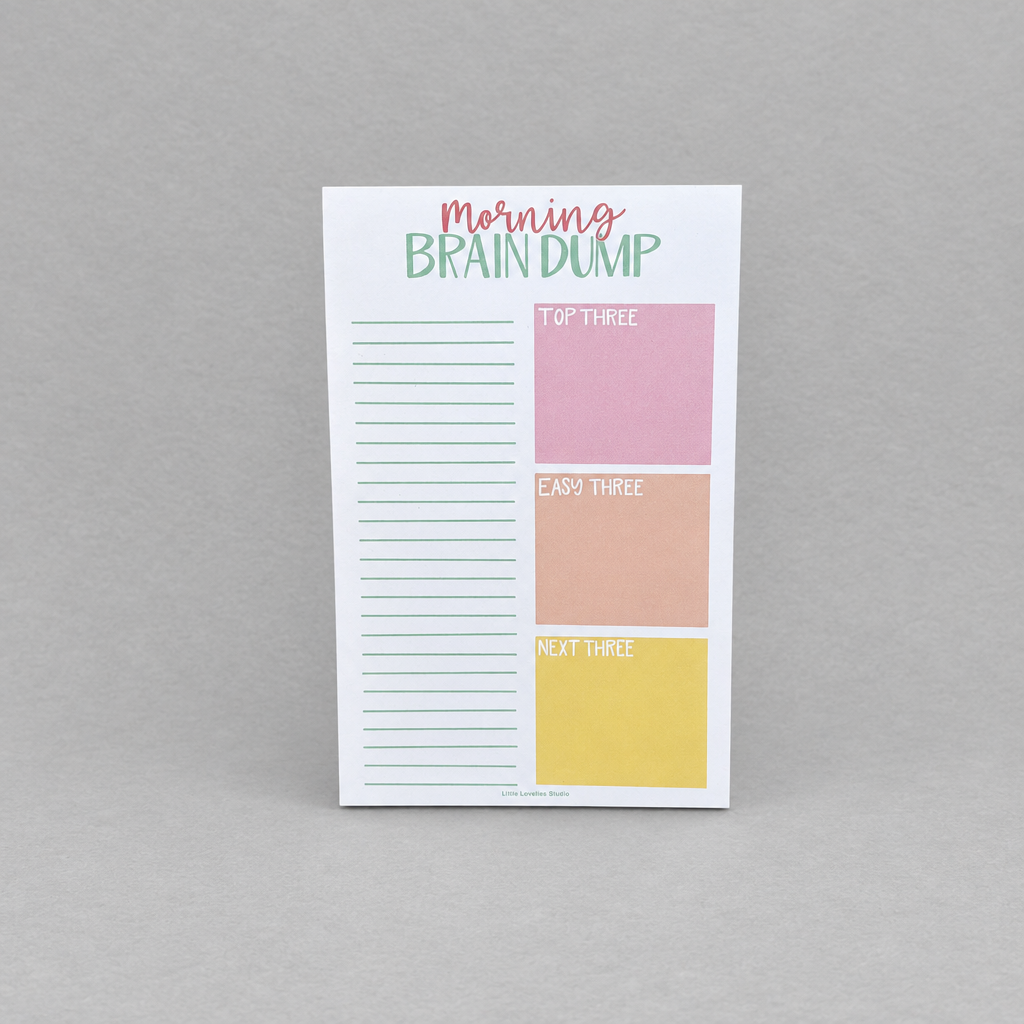 Impish Greetings Morning Brain Dump notepad with colorful task sections and lined paper for daily planning.