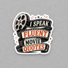 Impish Greetings I Speak Fluent Movie Quotes sticker featuring a film reel and vintage typography on a grey background.