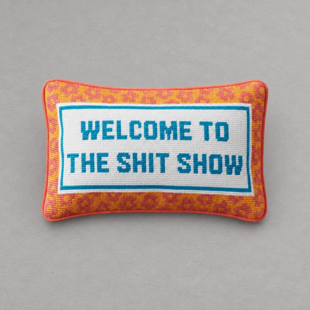 Impish Greetings needlepoint throw pillow with orange leopard print border and Welcome To The Shit Show text