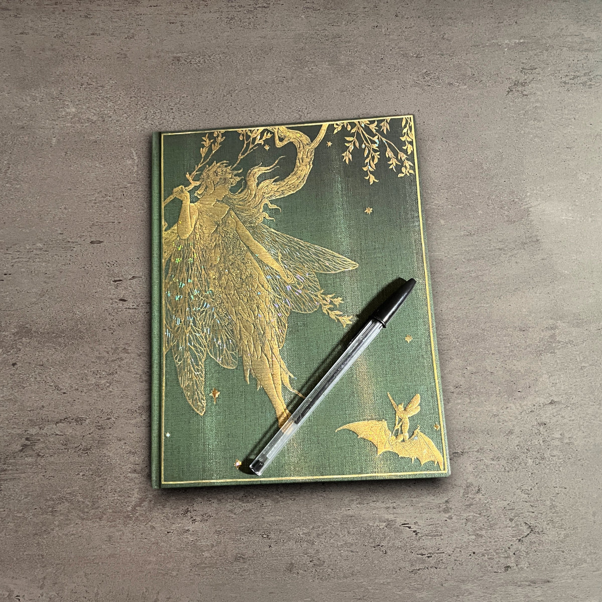 Impish Greetings Paperblanks Olive Fairy hardcover journal with ornate gold foil fairy design on a green textured cover