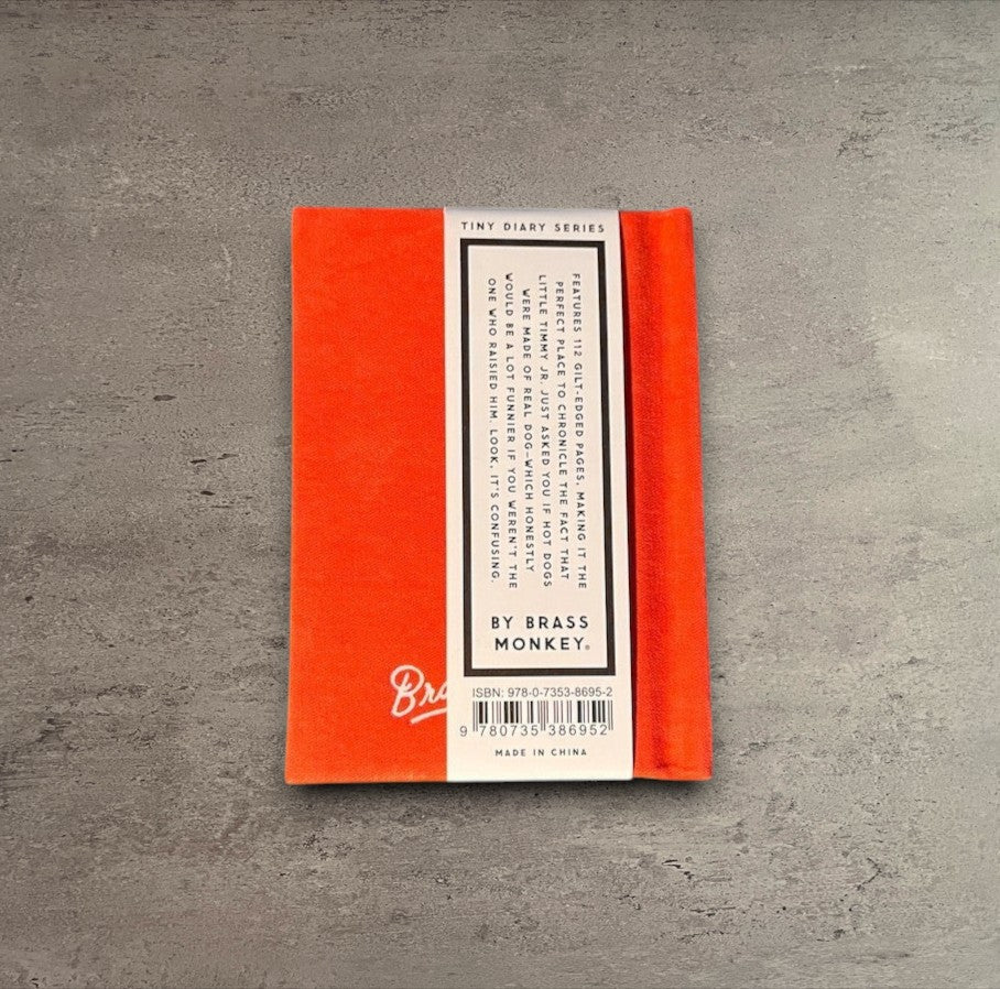 Impish Greetings Dumb Things My Kid Said tiny hard-bound felt diary with bright orange cover and gold-edged pages