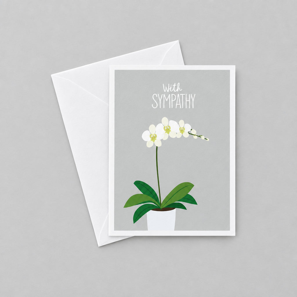 Impish Greetings sympathy card featuring a white orchid illustration on a grey background with white envelope