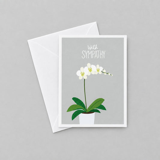 Impish Greetings sympathy card featuring a white orchid illustration on a grey background with white envelope
