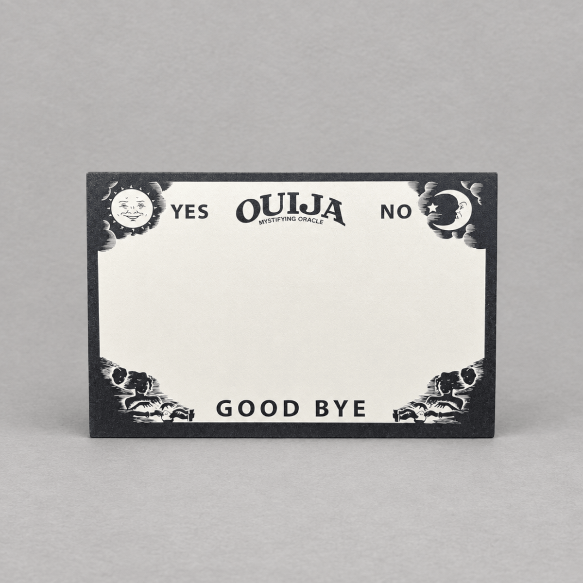 Impish Greetings Ouija board notepad with black and white mystical sun and moon illustrations on recycled paper