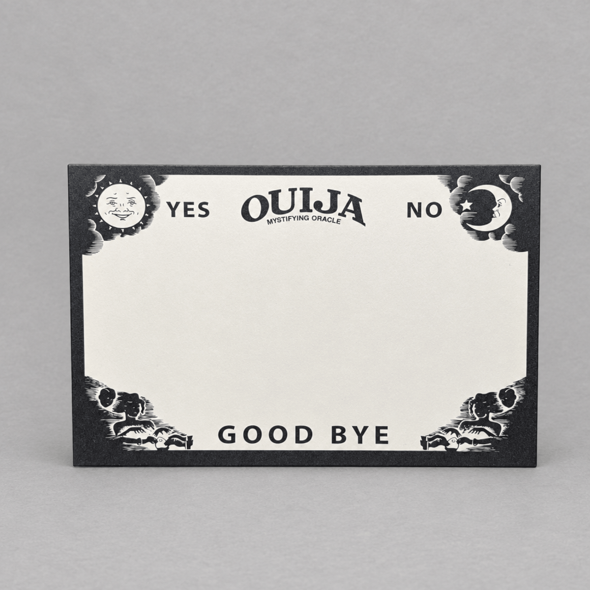 Impish Greetings Ouija board notepad with black and white mystical sun and moon illustrations on recycled paper