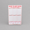 Impish Greetings pastel to-do list notepad with sections for tasks and a drink reward tracker on a grey background.