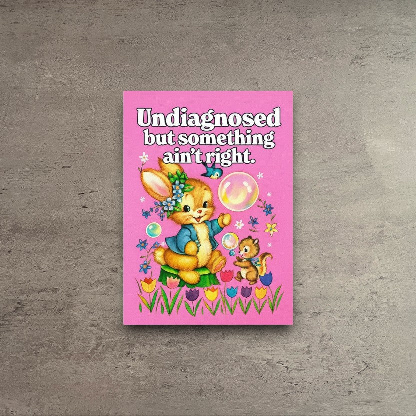 Vintage-style pink greeting card featuring a cute bunny and squirrel with the text Undiagnosed but something ain't right.