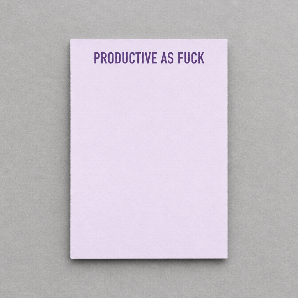 Impish Greetings Productive As Fuck notepad with purple text on a light lavender paper sheet