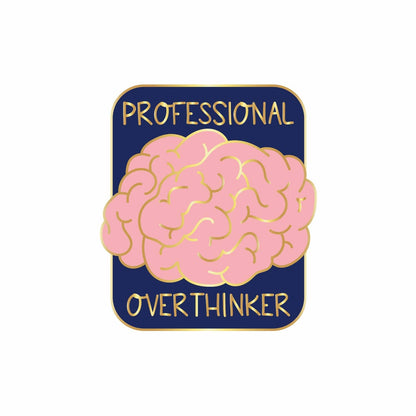 Impish Greetings Professional Over-thinker enamel pin featuring a pink brain design with gold plating on navy blue.