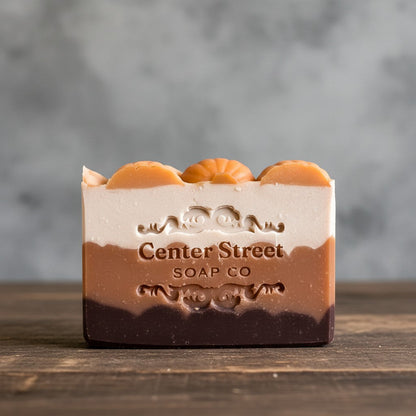 Impish Greetings handmade pumpkin spice bar soap with multi-layered earthy tones and decorative pumpkin accents