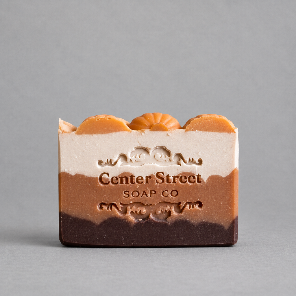 Impish Greetings handmade pumpkin spice bar soap with layered earthy tones and decorative pumpkin top accents.