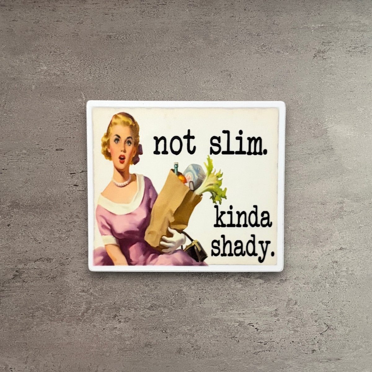 Impish Greetings Not Slim Kinda Shady vinyl sticker featuring a retro housewife illustration on a wooden background.