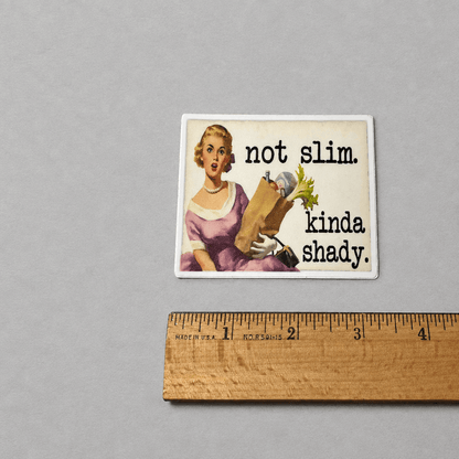 Impish Greetings retro housewife vinyl sticker with text Not slim. Kinda shady. on a matte waterproof finish.
